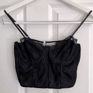 NWT black Bustier top with adjustable straps and zipper.
